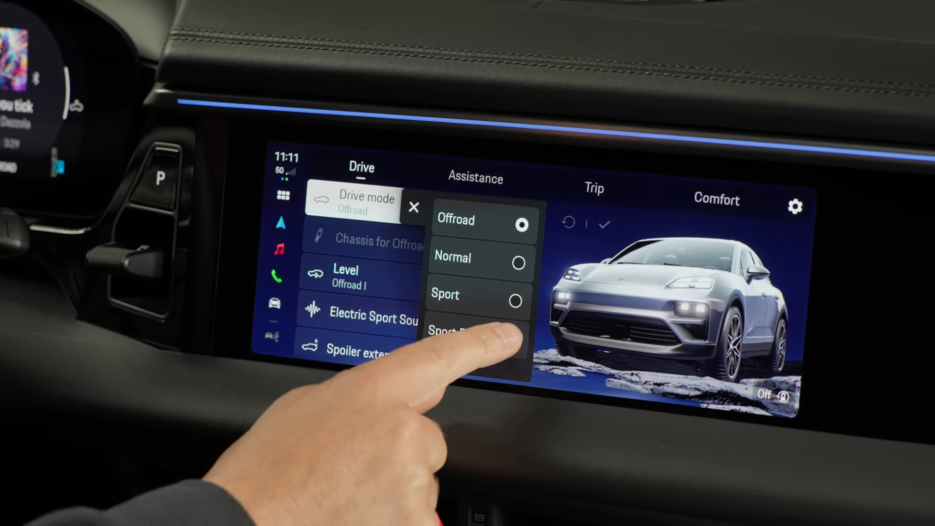 Macan infotainment display showing the Drive screen and drive mode selection